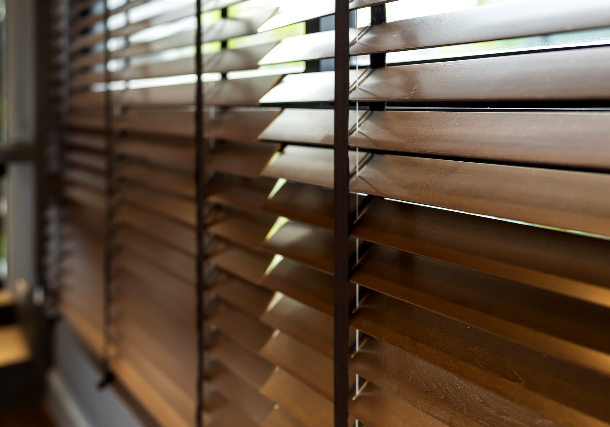 wooden window shutter blind with light from sun home interior concept